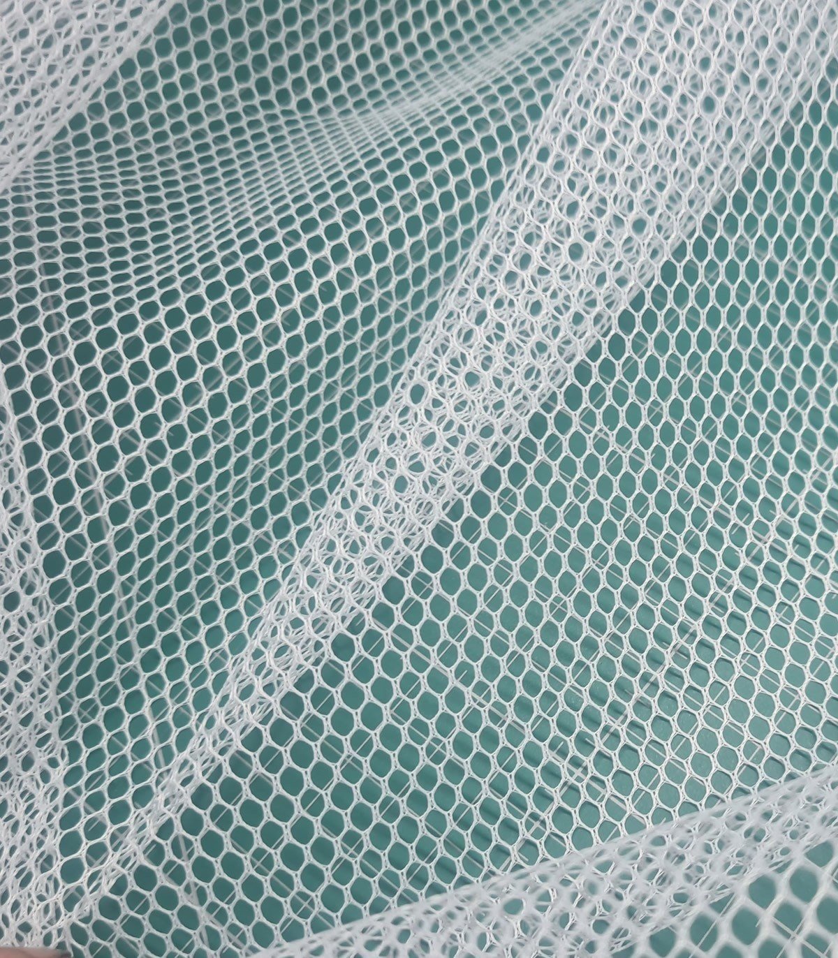 Moldable mesh clearance fabric