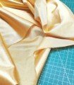 Tissu satiné marron doré pour carnaval